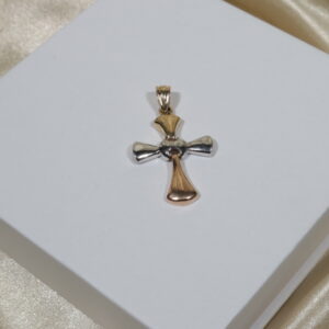 Dije cruz articulada 5.35gr/4cm/tres oros18k.