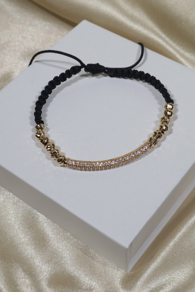 PULSERA NEGRA CILINDRO CURVO 5GR/5MM/ BOLAS DIAMANTADAS. / oro 18k